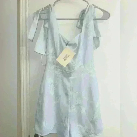 Electra Tie Shoulder Romper in Floral Flutter
by Love, Bonito size XS NWT - Picture 9 of 12